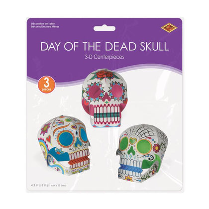 Packaging of Day of the Dead skull decorations with three colorful skulls on a white background.