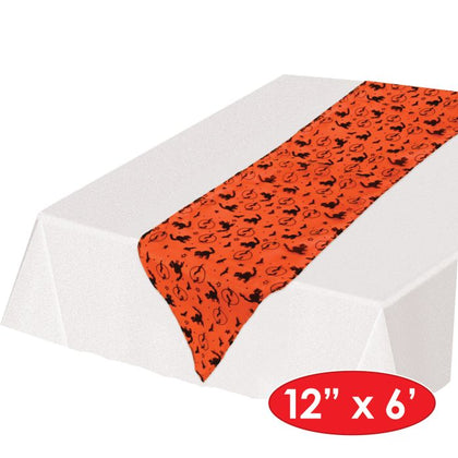 Orange table runner with black cat pattern on a white background