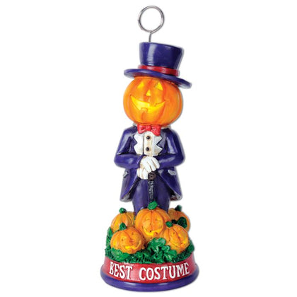 Halloween decoration with a jack-o'-lantern in a suit and top hat, surrounded by pumpkins, on a white background.