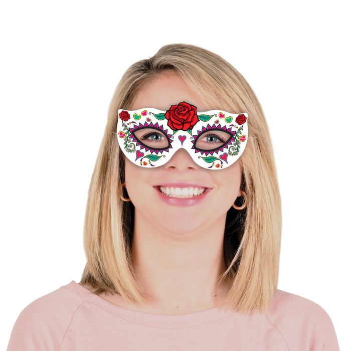 Person wearing a colorful eye mask with floral designs on a white background