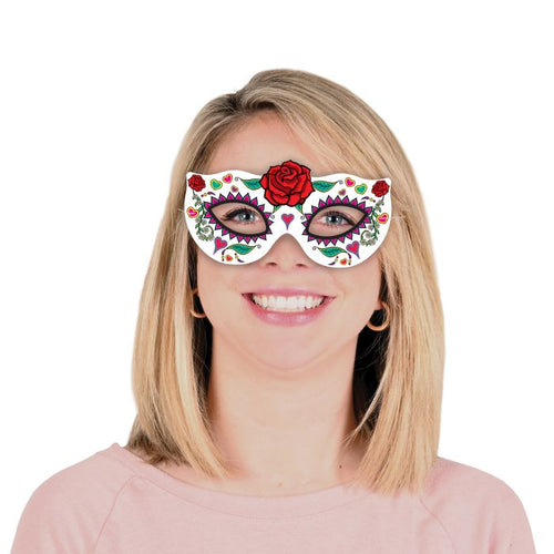 Person wearing a colorful eye mask with floral designs on a white background