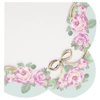 Decorative letter 'Q' with flowers and a bow on a light blue background