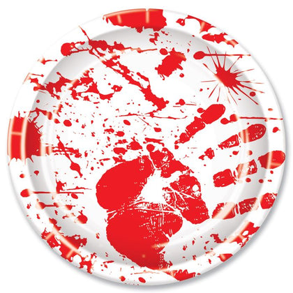 White plate with red splatter design on a white background