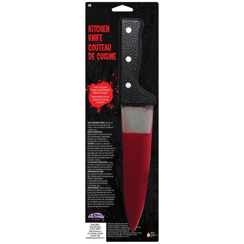 A Halloween kitchen knife prop with a textured black handle and a fake blood-filled blade, packaged on a black retail card with red text.