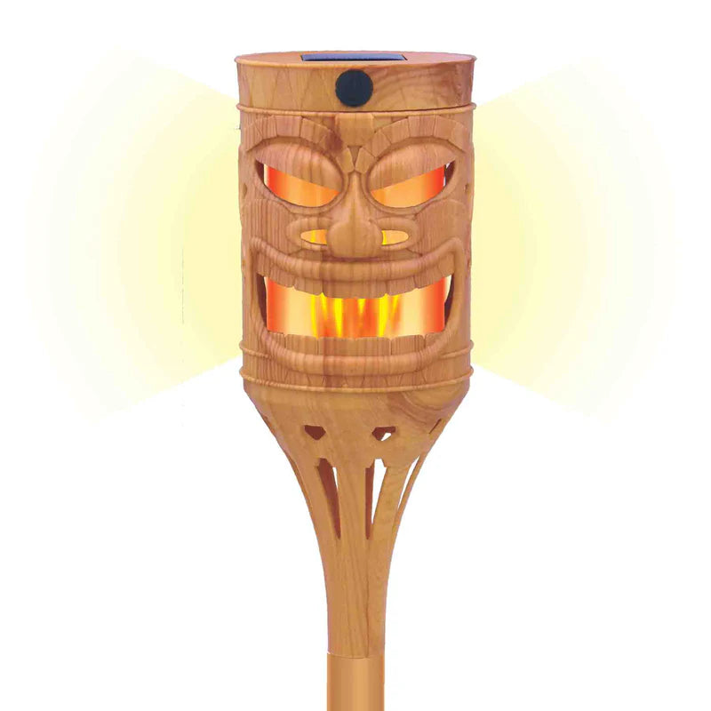 Wooden tiki torch with face design on a white background