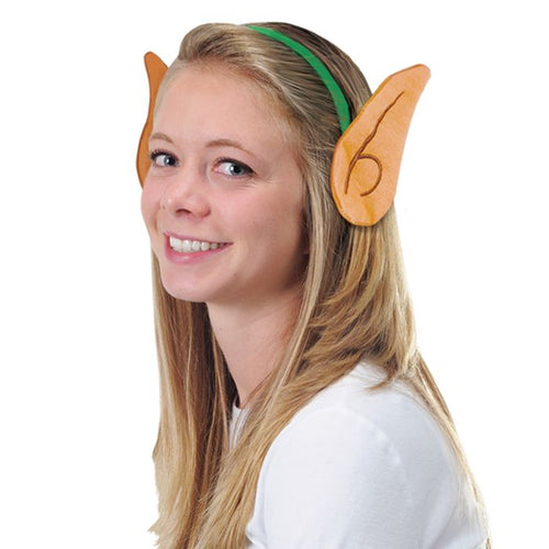 Person wearing elf ears with a white background