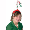 Person wearing a festive headband with a candy cane design on a white background