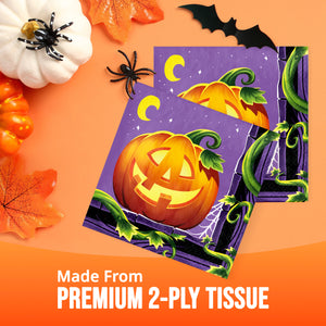 Two Halloween-themed tissue papers with a purple background, a carved orange pumpkin, green vines, and crescent moons, displayed on an orange background with autumn props and the text 'Made From PREMIUM 2-PLY TISSUE'.