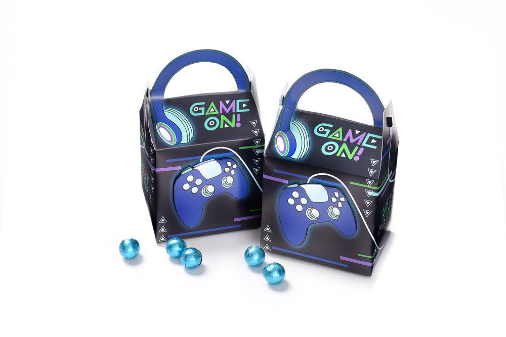 Two 'Game On!' themed boxes with blue handles and game controller designs, surrounded by small blue balls on a white background.