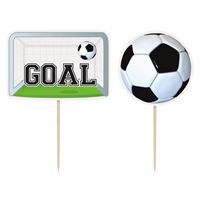 Soccer-themed party decorations including a 'GOAL' sign and soccer ball on sticks.