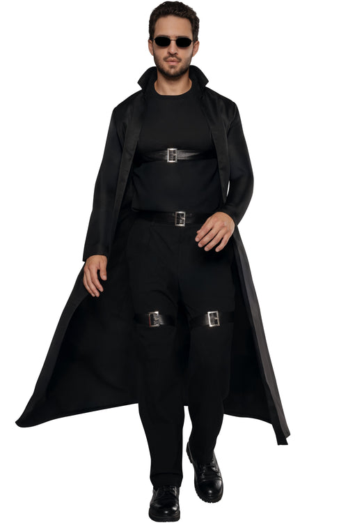A man modeling a black long trench coat costume with matching black pants, black belt, and black sunglasses against a plain white background.
