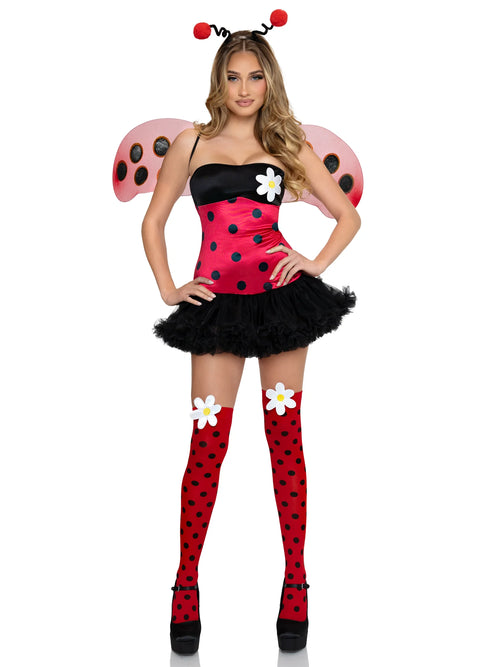 A woman modeling a ladybug costume consisting of a red and black polka-dot strapless top with a black tutu skirt, pink wings with black spots, red polka-dot thigh-high socks, and white flower accessories, on a plain white background.
