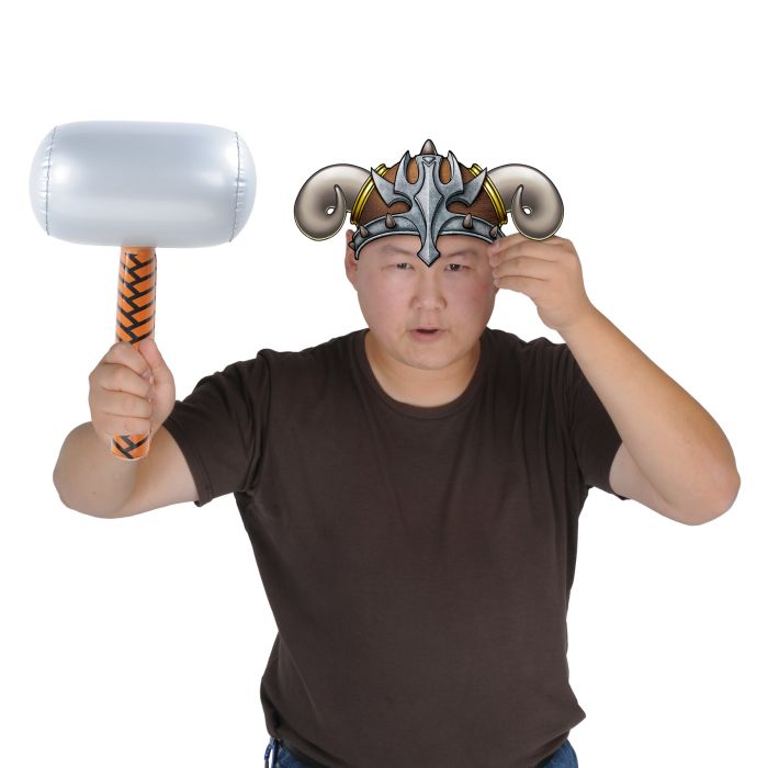 Person wearing a fantasy-style helmet and holding a large hammer on a white background
