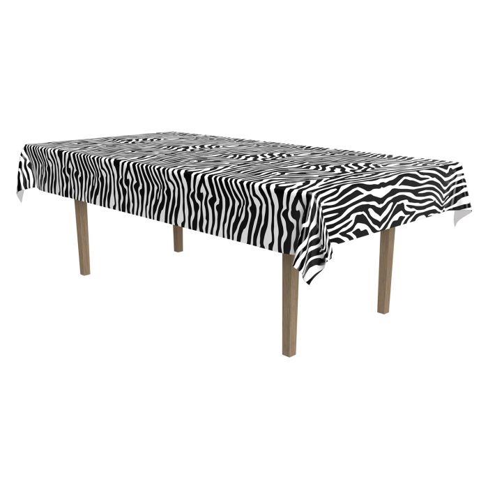Table with a zebra print tablecloth on a white background