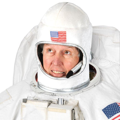 Person wearing an astronaut suit with a visible American flag on the helmet.