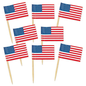 Set of small American flags on toothpicks against a white background