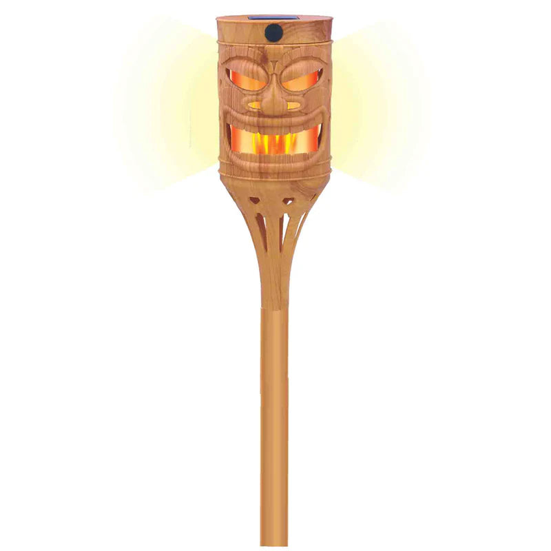 Bamboo tiki torch with face design on a white background