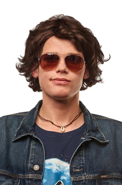 Person wearing sunglasses and a denim jacket on a white background