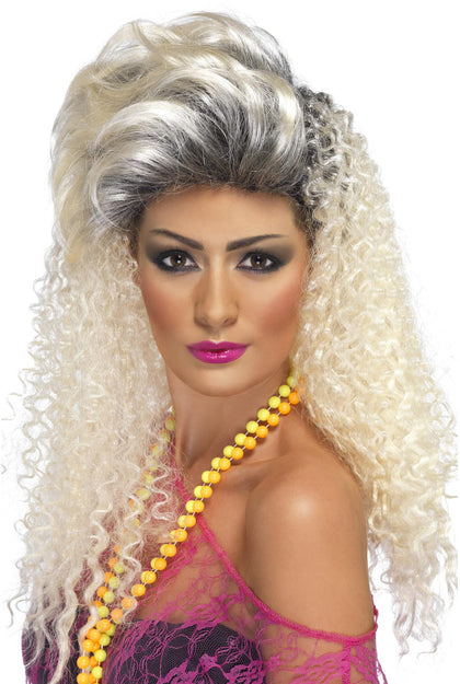 Woman with a blonde wig and yellow beads on a white background