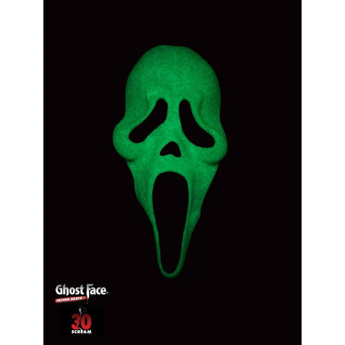 A green glow-in-the-dark Ghost Face mask centered on a black background, with the Ghost Face logo and a small red '30 SCARF-IN' badge near the bottom left.