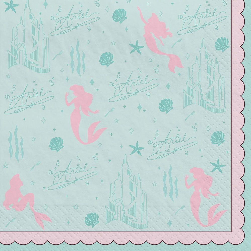 Napkin with mermaid and castle design on a light blue background