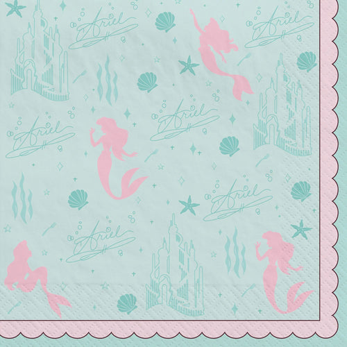 Napkin with mermaid and castle design on a light blue background