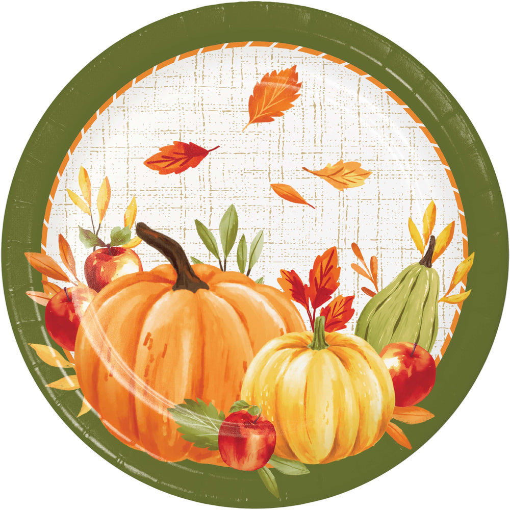 A round autumn-themed paper plate or placemat featuring pumpkins, apples, leaves, and a green border on a white background.