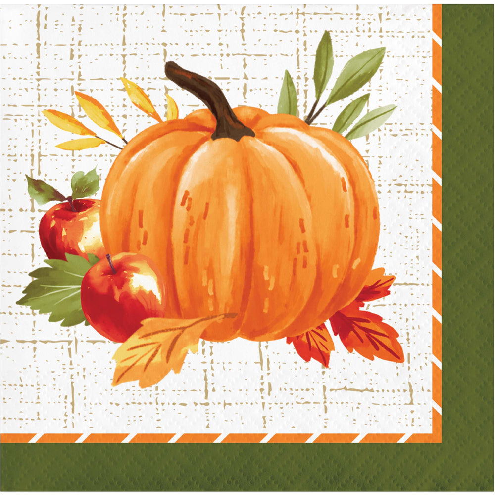 A square autumn-themed paper napkin featuring a painted orange pumpkin, two red apples, green and yellow leaves, and a white textured background with an orange and green border.
