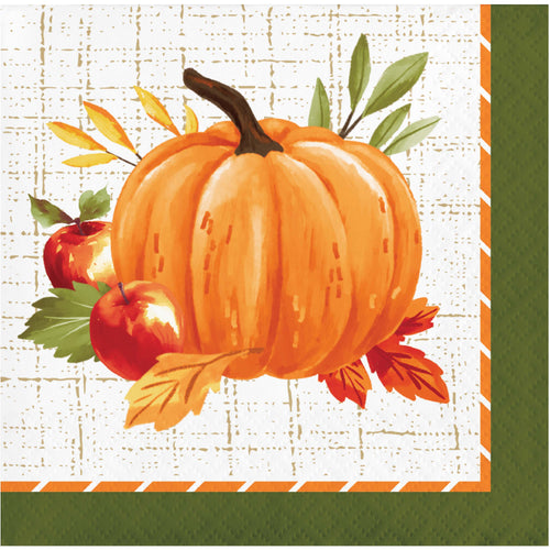 A square autumn-themed paper napkin featuring a painted orange pumpkin, two red apples, green and yellow leaves, and a white textured background with an orange and green border.