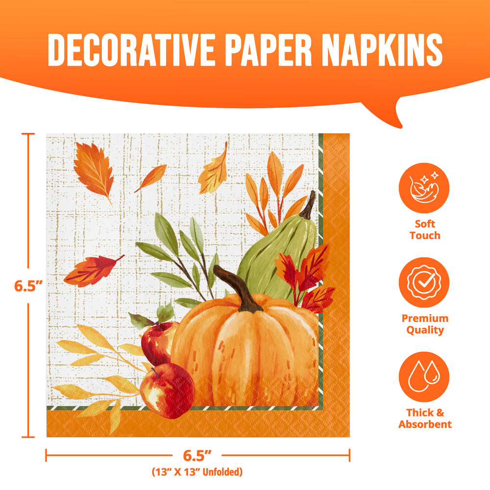 Decorative paper napkins with an autumn harvest illustration featuring a pumpkin, apples, leaves, and a gourd on a white grid background with orange borders. The image includes dimension markings showing 6.