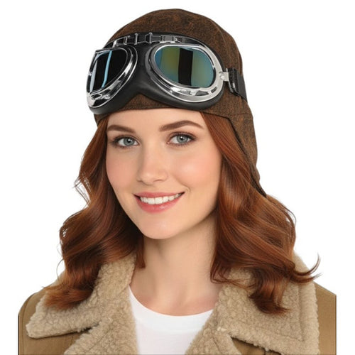 A woman wearing a brown aviator-style hat with attached goggles and a beige sherpa collar, shown against a plain white background.