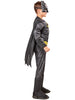 Child wearing a Batman costume on a white background