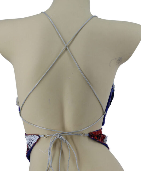 Mannequin wearing a strappy bikini with a colorful bottom on a white background