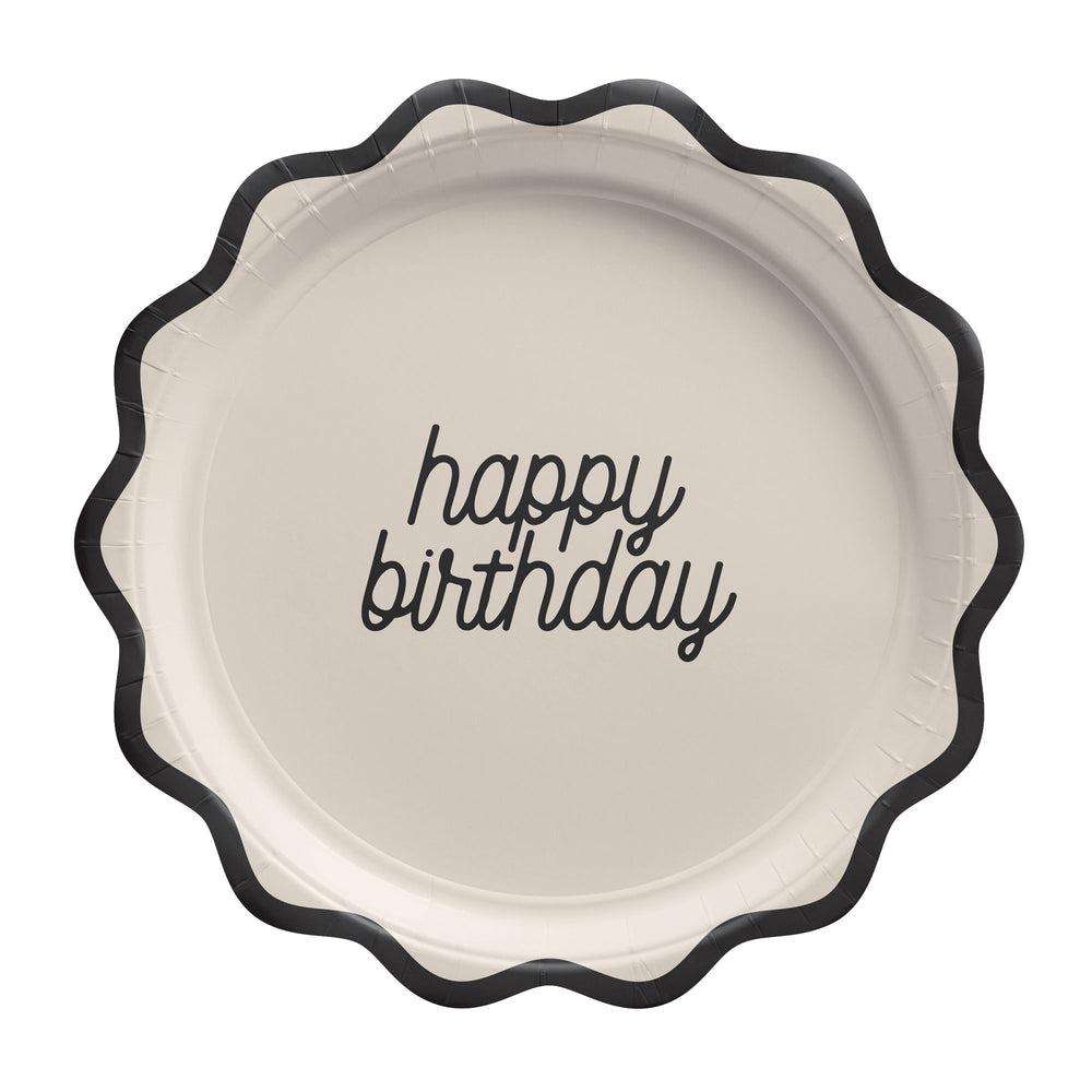Round paper plate with 'happy birthday' text on a white background