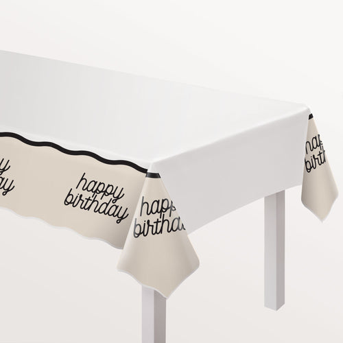 Beige tablecloth with 'happy birthday' text on a white background