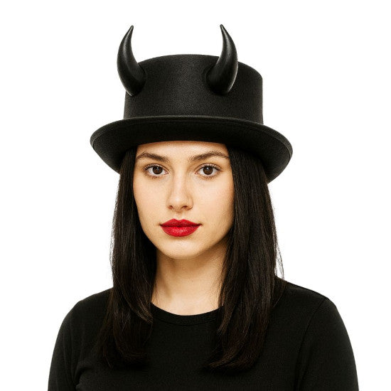 A woman wearing a black top hat with two curved horns, photographed against a plain white background.