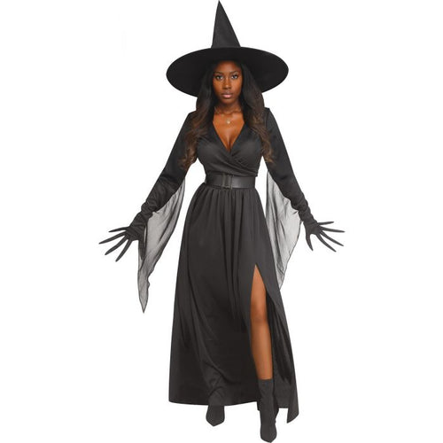A woman modeling a black witch costume consisting of a long dress with a thigh slit, long gloves with clawed tips, and a tall pointed witch hat, shown against a plain white background.