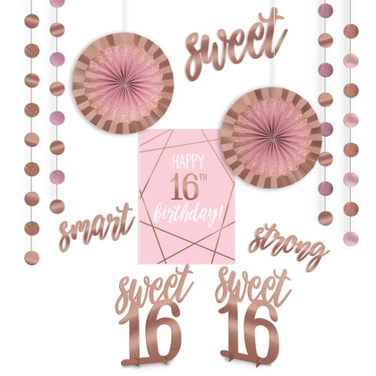 Decorative set for a sweet 16th birthday party with pink and rose gold elements.