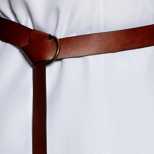 Brown belt with a gold buckle on a white shirt