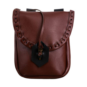 Brown leather bag with decorative strap on a white background