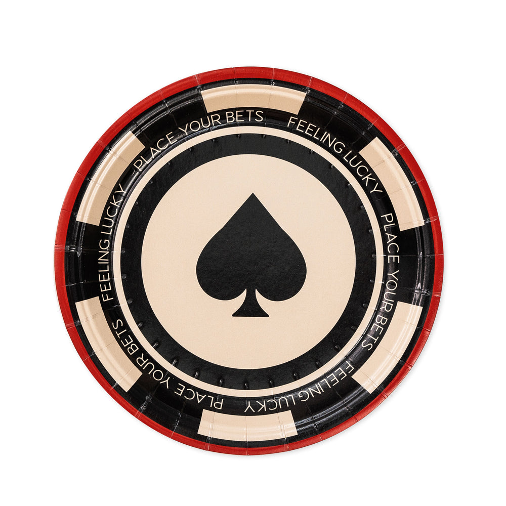 Paper plate with a spade symbol and gambling-themed text on a white background