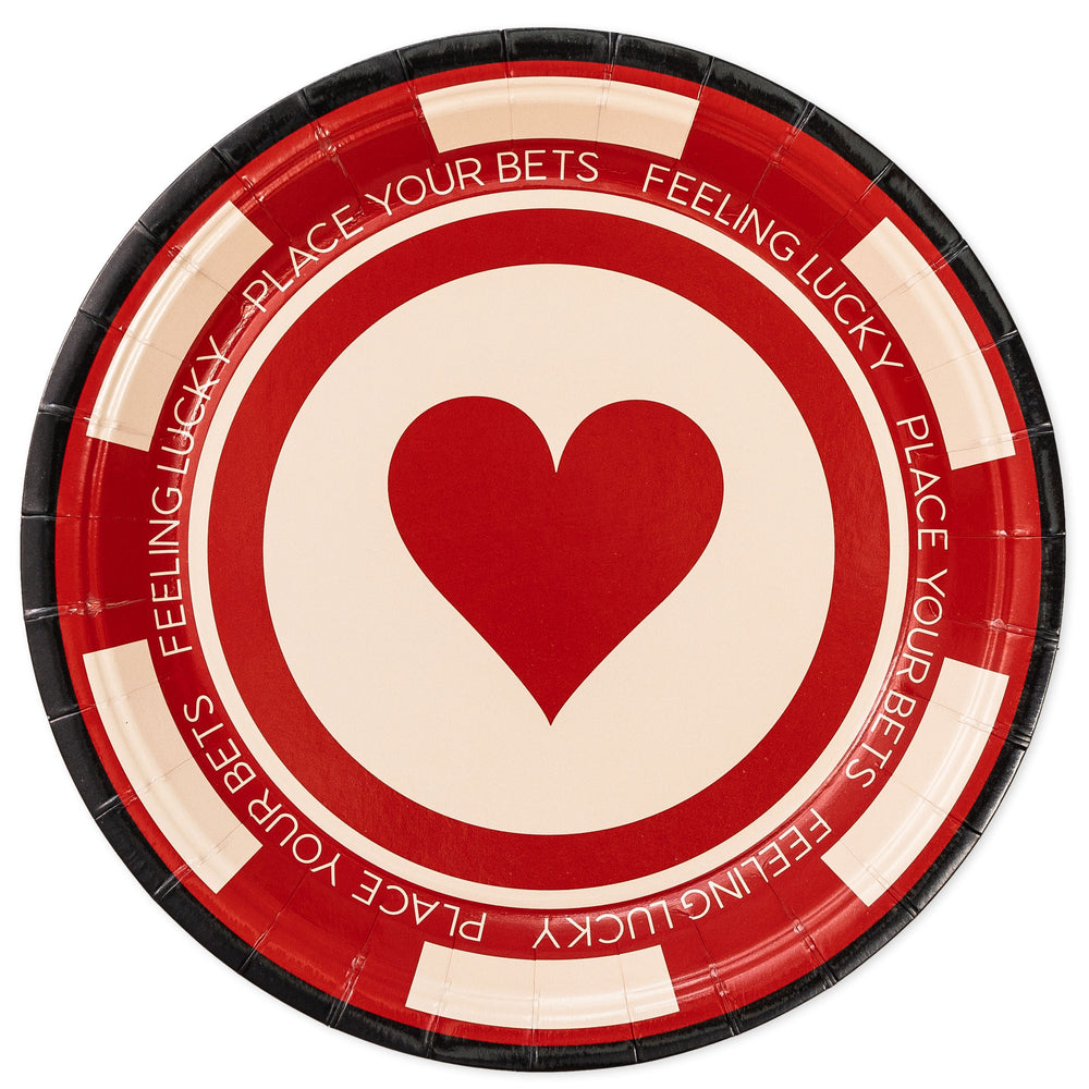 Round paper plate with red heart and text on a white background