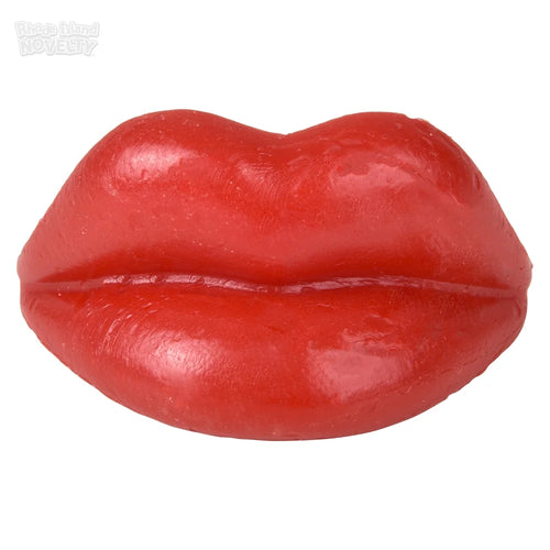 Red rubber lip toy on a white background