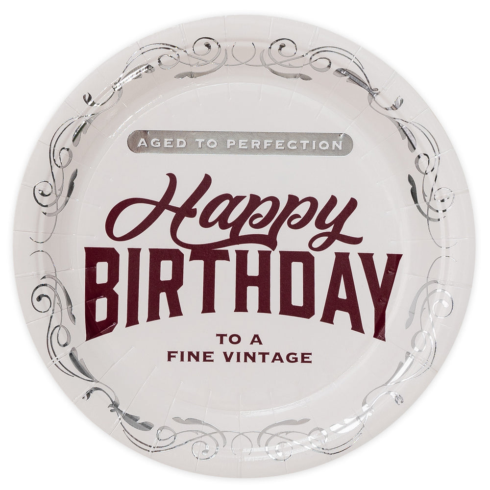 Round white plate with maroon text 'Happy Birthday to a fine vintage' on a white background