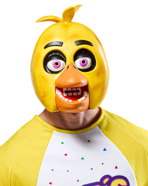 Person wearing a yellow chicken mask with a white shirt featuring colorful designs.