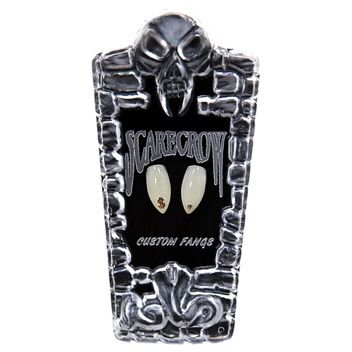 A coffin-shaped display card for custom nail art fangs, featuring a skull at the top, a black center with the words 'SCARECROW' and 'CUSTOM FANGS', and two sample fangs mounted in the middle. The fangs are off-white with small gold and black details.