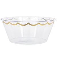 Clear glass bowl with gold rim on a white background