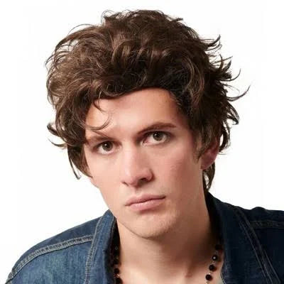 Man with styled hair wearing a denim jacket on a white background