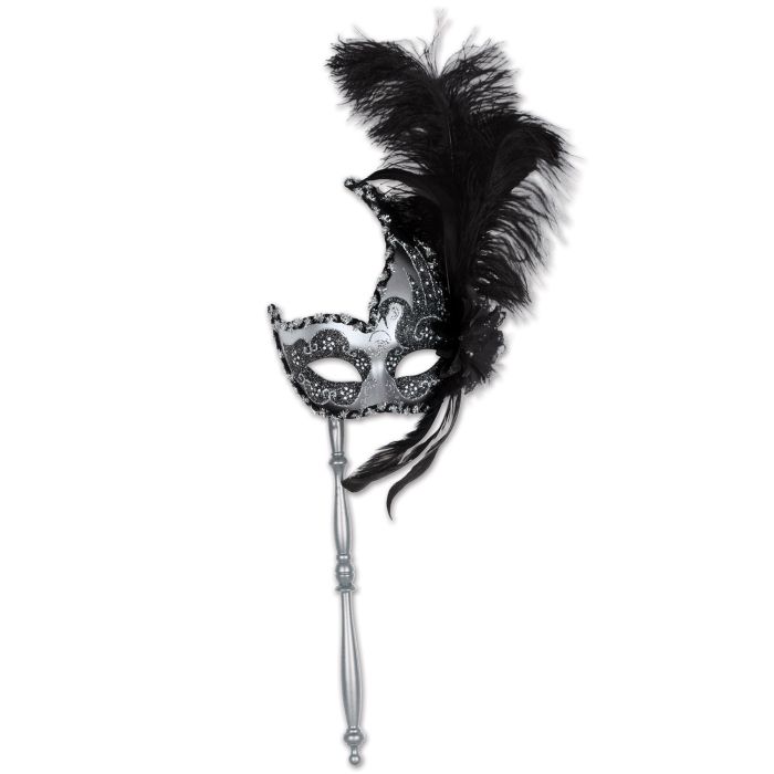 Black and silver mask on a stick with feathers against a white background