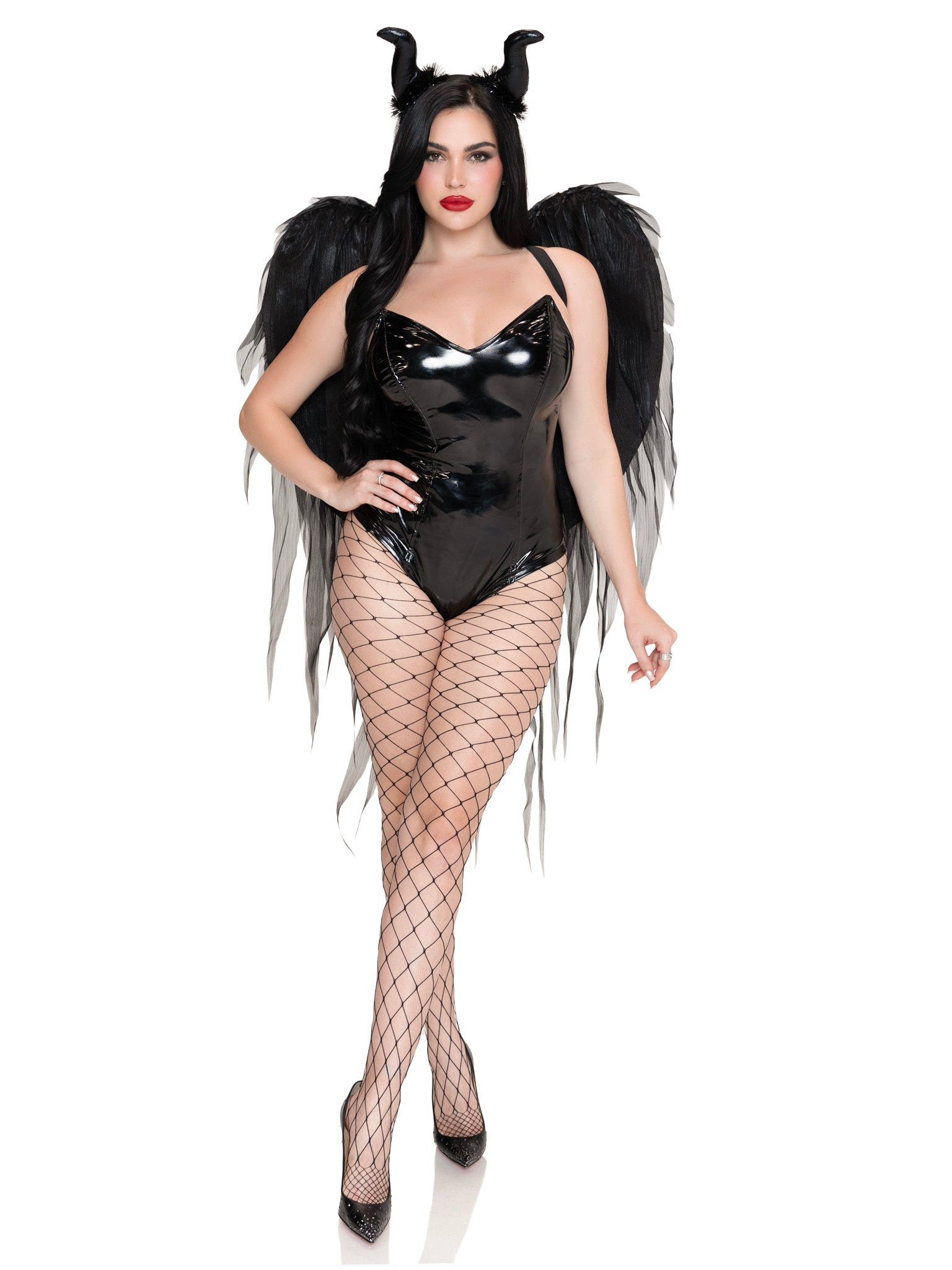 A woman modeling a black devil costume set featuring a glossy black bodysuit, large black feather wings, black horn headpiece, and black fishnet tights, against a plain white background.